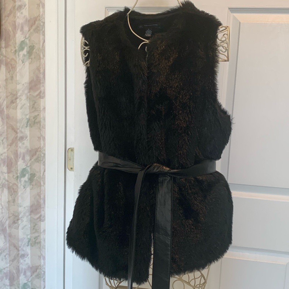Beautiful Faux fur black vest with belt. Smoke & pet free home.